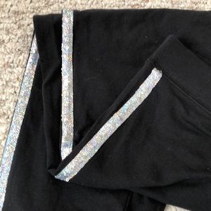 Black leggings with silver sequins on the sides